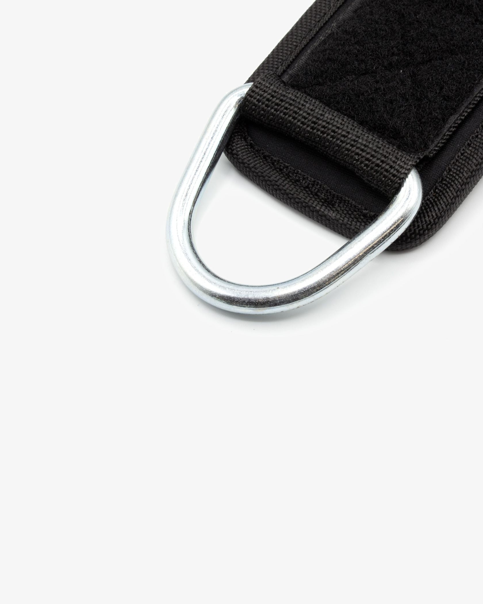Detailed view of the reinforced steel D-ring connector on the Fortex ankle strap.