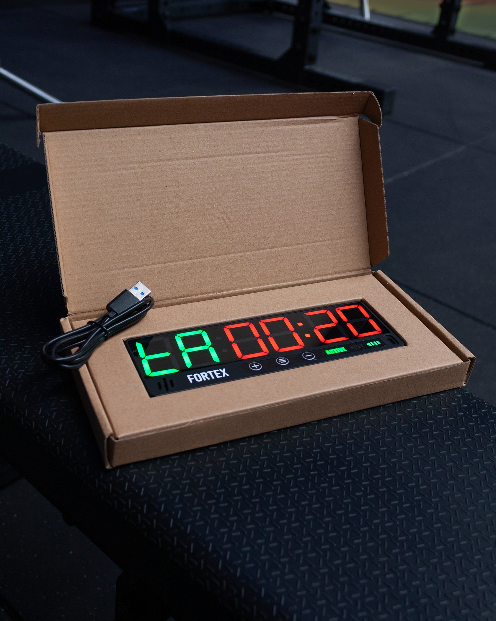 Securely packaged Fortex Mini Gym Timer comes with a USB-C charging cable.